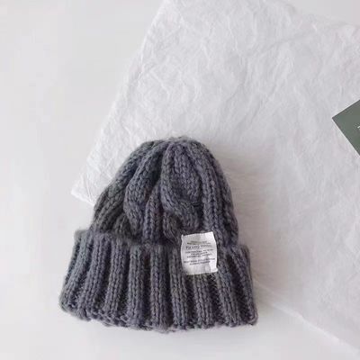 Gepersonaliseerd logo Vaste kleur Japanse Twist gebreide hoed voor de herfst en winter studenten