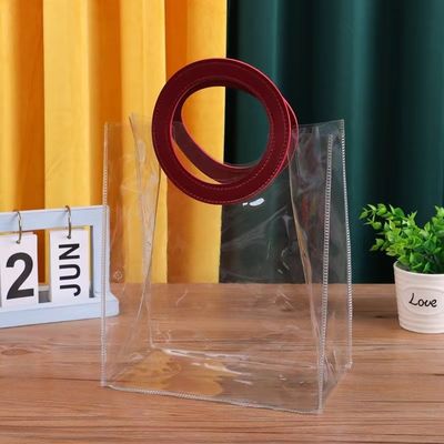 Gepersonaliseerd logo geaccepteerd PVC heldere plastic tas met die cut handvat