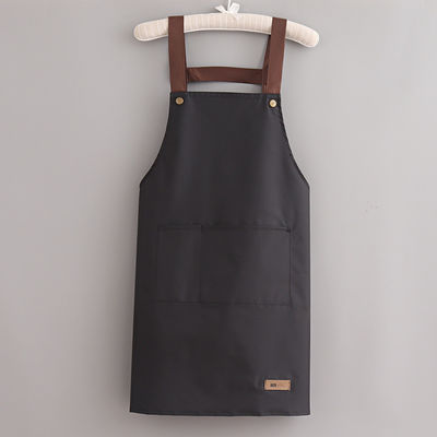 Kleurrijke katoenen polyester kokkoek met verstelbare riemen op doekstof