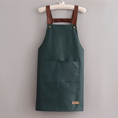 Kleurrijke katoenen polyester kokkoek met verstelbare riemen op doekstof