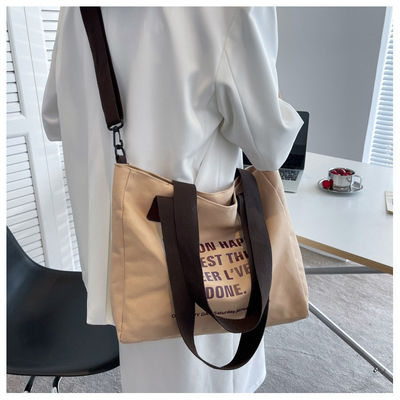 Gepersonaliseerde logo brief katoenen doek Tote zak met polyester bekleding en grote capaciteit
