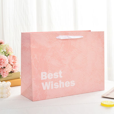 Op maat gemaakte gedrukte logo Luxe Boutique Shopping Papieren geschenkzakken voor verpakkingsartikelen