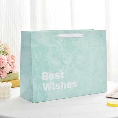 Op maat gemaakte gedrukte logo Luxe Boutique Shopping Papieren geschenkzakken voor verpakkingsartikelen