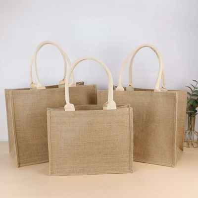 Milieuvriendelijke jute winkeltassen met op maat gedrukt logo en leren handgrepen