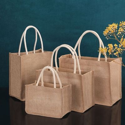Milieuvriendelijke jute winkeltassen met op maat gedrukt logo en leren handgrepen