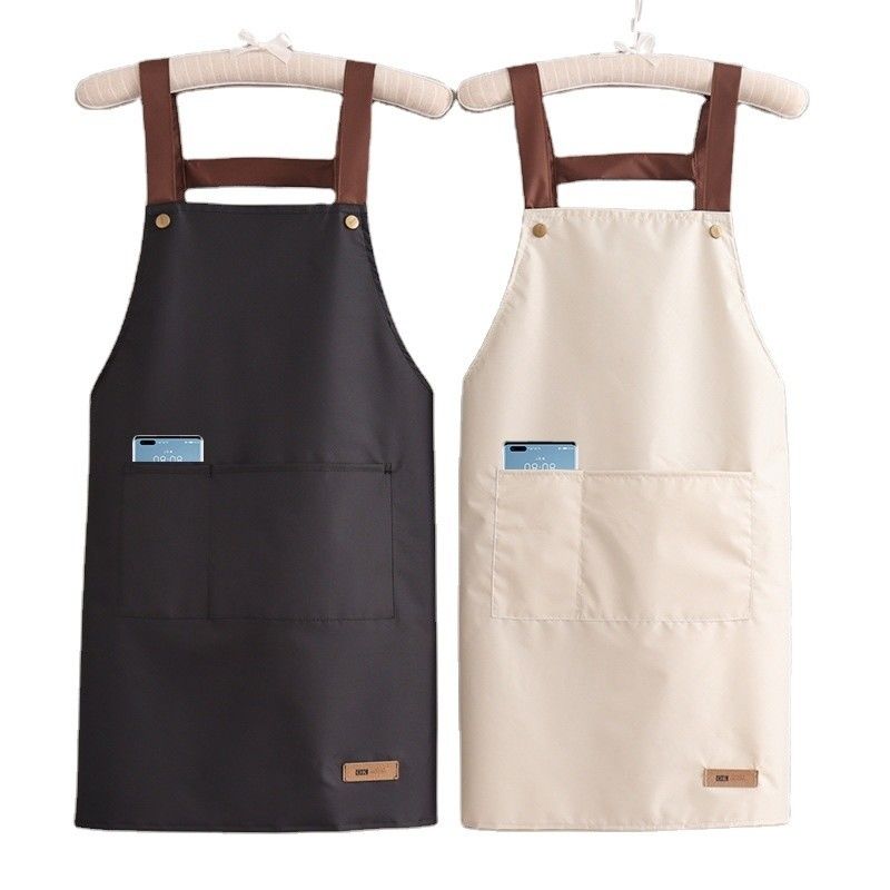 Kleurrijke katoenen polyester kokkoek met verstelbare riemen op doekstof